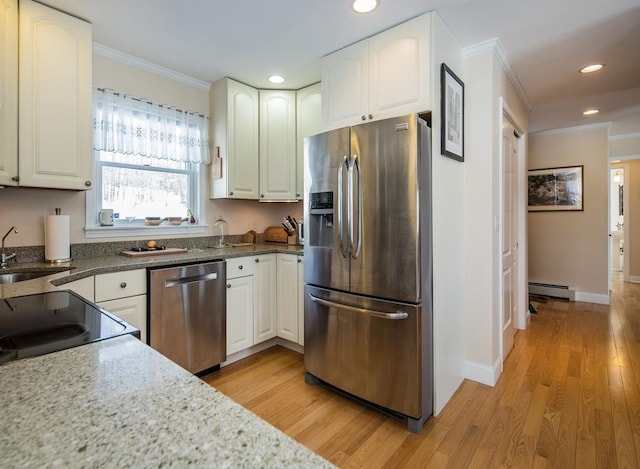 2400 Upper Cold River Rd, Shrewsbury, VT 05738 - kitchen featuring stainless steel appliances, white cabinetry, a baseboard radiator, and crown molding