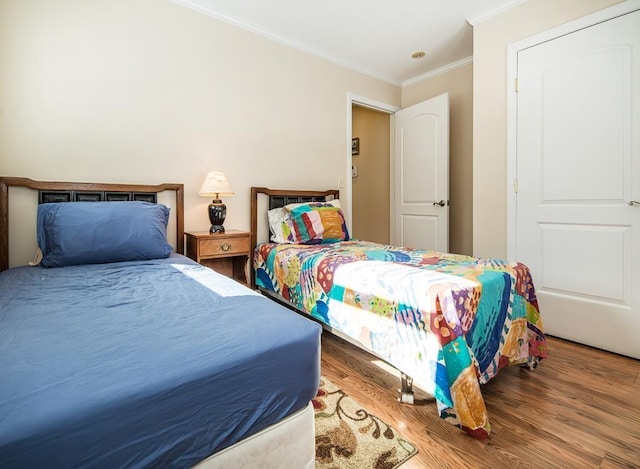 2400 Upper Cold River Rd, Shrewsbury, VT 05738 - bedroom with hardwood / wood-style flooring and crown molding