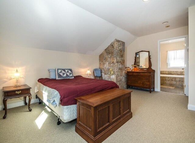 2400 Upper Cold River Rd, Shrewsbury, VT 05738 - carpeted bedroom with connected bathroom and lofted ceiling