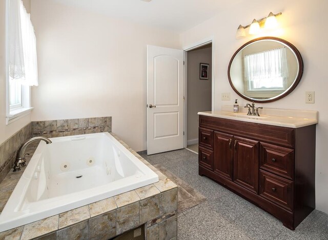 2400 Upper Cold River Rd, Shrewsbury, VT 05738 - bathroom featuring vanity and tiled tub