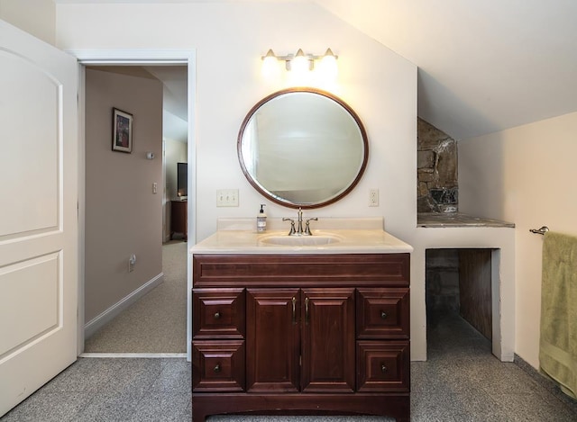 2400 Upper Cold River Rd, Shrewsbury, VT 05738 - bathroom with vaulted ceiling and vanity