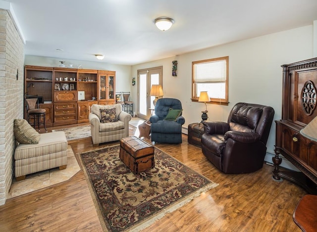 2400 Upper Cold River Rd, Shrewsbury, VT 05738 - living room with hardwood / wood-style flooring and a baseboard heating unit
