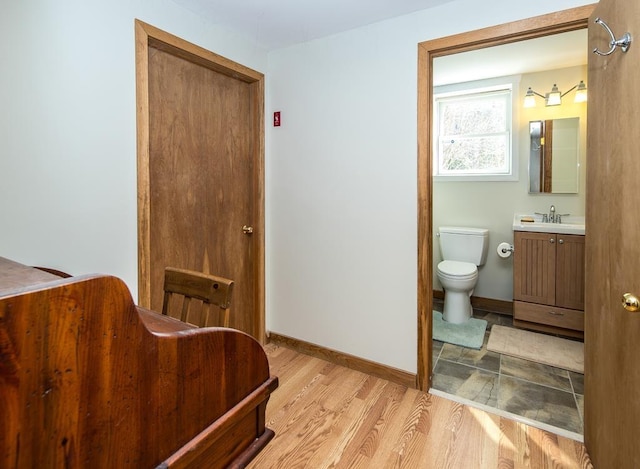 2400 Upper Cold River Rd, Shrewsbury, VT 05738 - interior space with toilet, vanity, and wood-type flooring