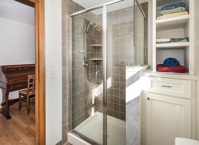 2400 Upper Cold River Rd, Shrewsbury, VT 05738 - bathroom featuring a shower with shower door and hardwood / wood-style floors