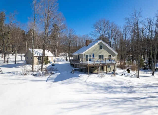 2400 Upper Cold River Rd, Shrewsbury, VT 05738 - snow covered back of property featuring a deck