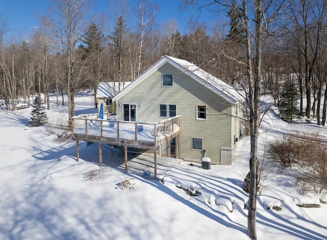 2400 Upper Cold River Rd, Shrewsbury, VT 05738 - snow covered rear of property with a wooden deck
