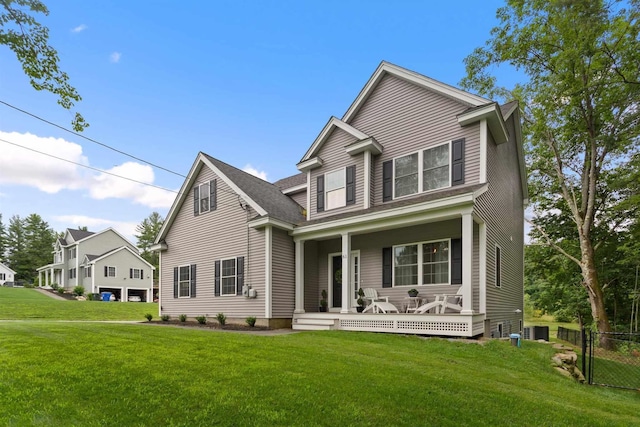 view of front of house featuring covered porch and a front yard