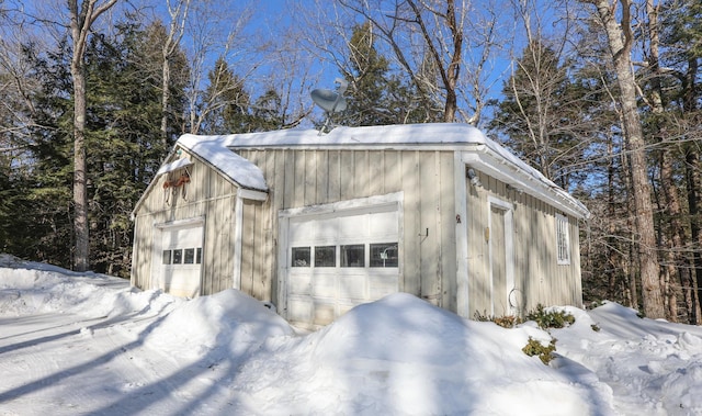 view of snow covered garage