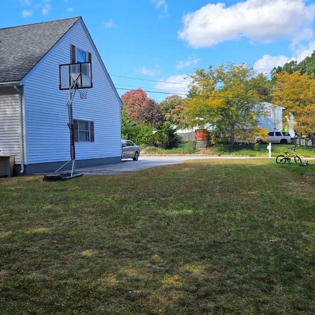 view of side of home featuring a lawn