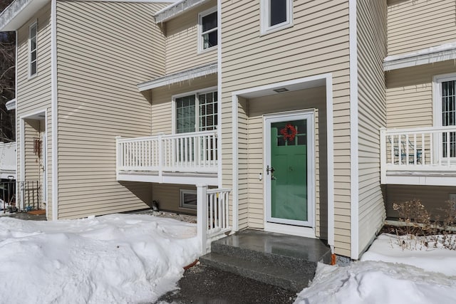 view of snow covered property entrance