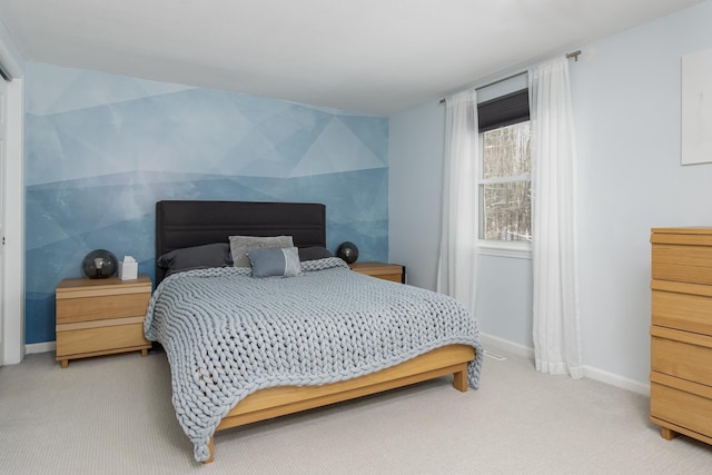 bedroom featuring baseboards and light colored carpet