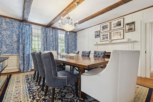 dining room with beamed ceiling, an inviting chandelier, and wood-type flooring