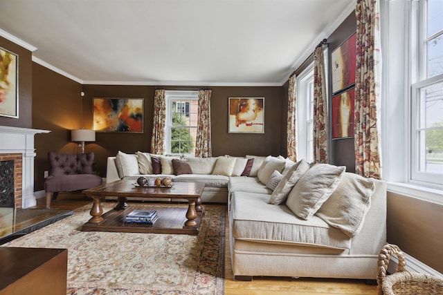 living room featuring a brick fireplace, crown molding, and hardwood / wood-style floors