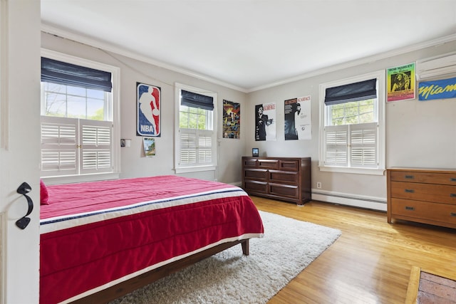 bedroom with a wall mounted AC, ornamental molding, light hardwood / wood-style flooring, and baseboard heating