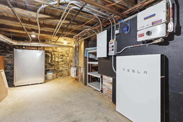 basement with stainless steel refrigerator