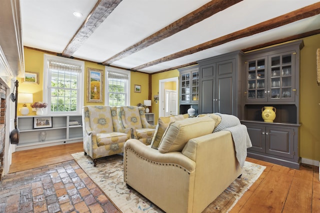 living room featuring beam ceiling