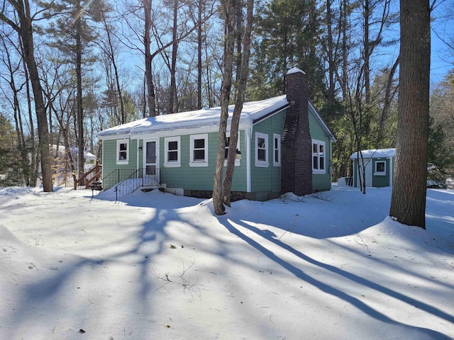 view of front of house featuring a shed