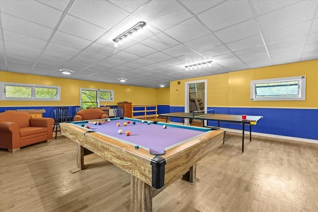 playroom with a paneled ceiling, pool table, a wealth of natural light, and wood-type flooring