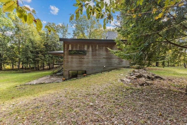 view of side of property with a yard