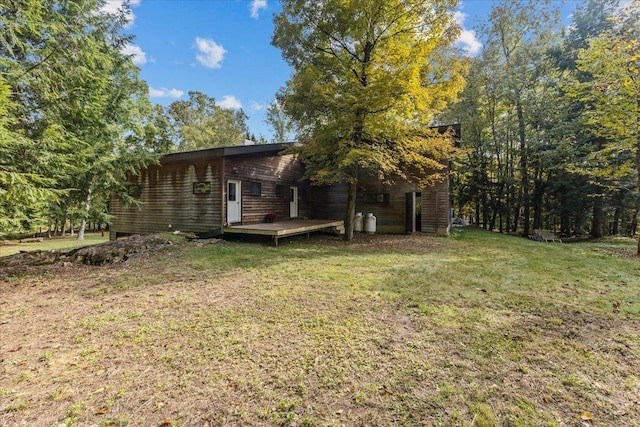 exterior space with a lawn and a deck