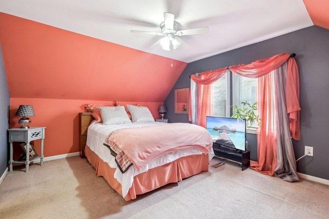 bedroom with lofted ceiling, carpet, and baseboards