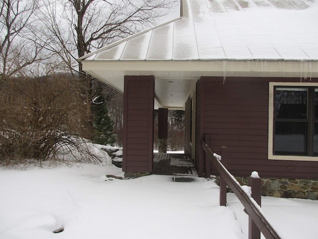 view of snow covered property entrance