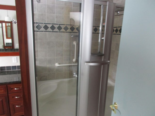 bathroom with a shower with shower door