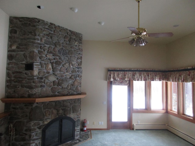 unfurnished living room featuring a fireplace, ceiling fan, carpet floors, and baseboard heating