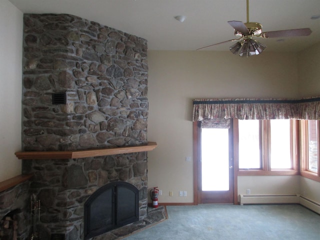 unfurnished living room with a fireplace, carpet flooring, and ceiling fan