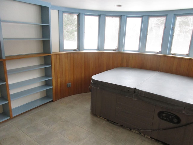 home office with plenty of natural light and wooden walls