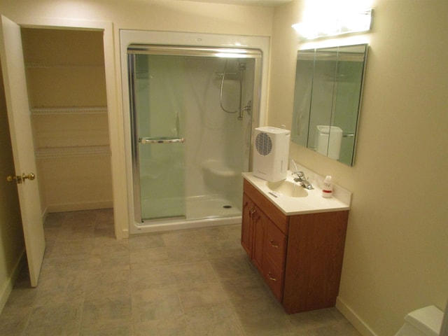 bathroom with vanity and walk in shower