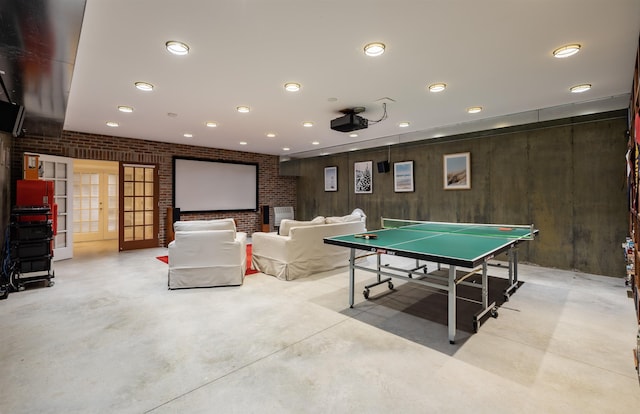 playroom with french doors and brick wall