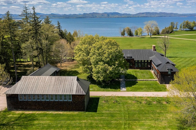 aerial view featuring a water and mountain view