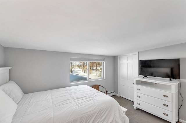 bedroom with carpet and a baseboard radiator