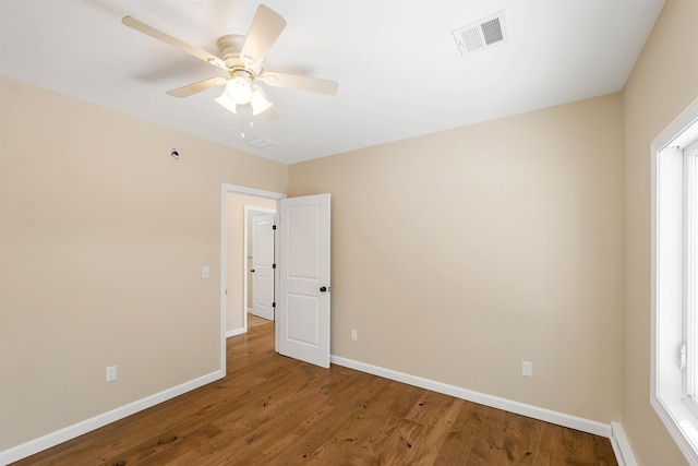 unfurnished room featuring hardwood / wood-style floors and ceiling fan