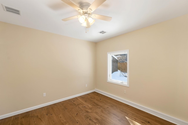 empty room with ceiling fan and wood-type flooring