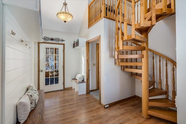 entryway with hardwood / wood-style floors