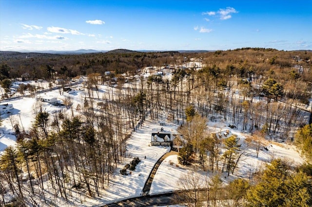 snowy aerial view with a mountain view