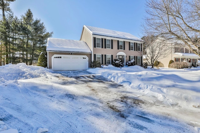 colonial inspired home with a garage