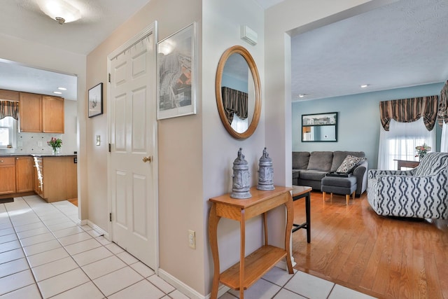 foyer entrance featuring light tile patterned flooring