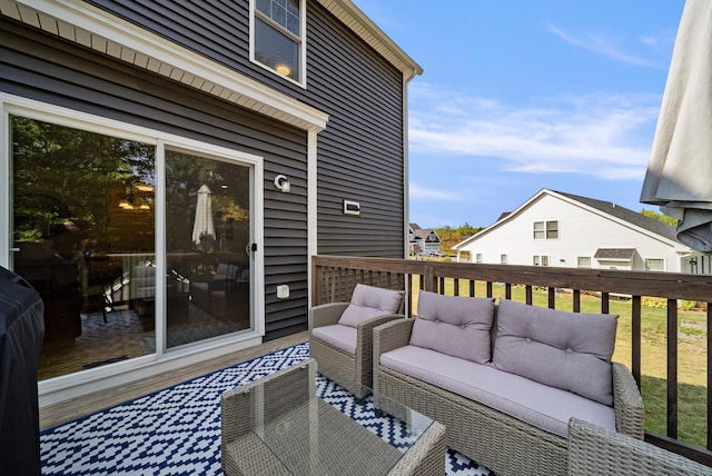 wooden terrace with outdoor lounge area