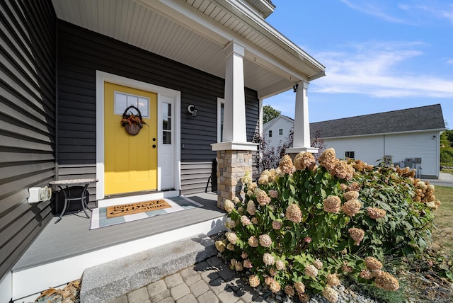 doorway to property featuring a porch