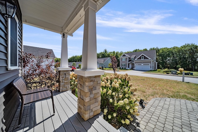 deck with a garage and a porch