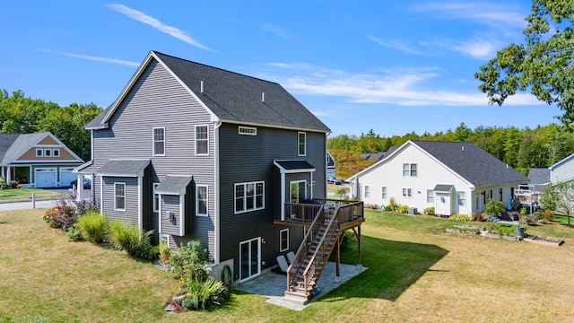 back of house featuring a lawn and a wooden deck