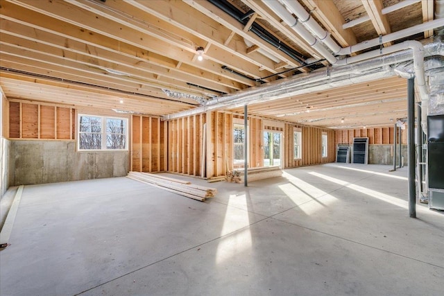 misc room featuring concrete flooring and plenty of natural light