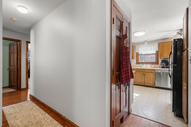 hallway with light wood-type flooring