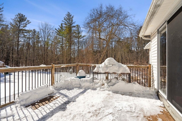 view of snow covered deck