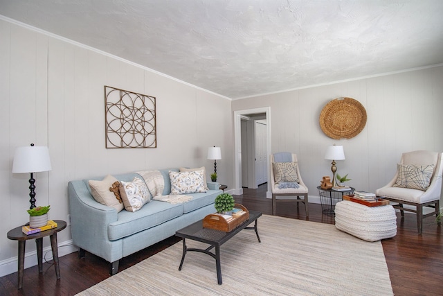 living room with hardwood / wood-style flooring and ornamental molding