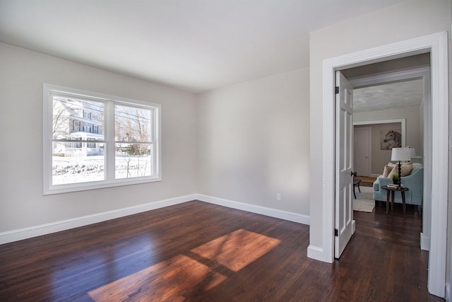 unfurnished room featuring dark hardwood / wood-style floors