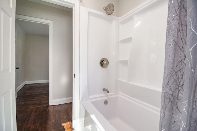 bathroom featuring shower / bath combination with curtain and wood-type flooring